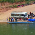 Photo of a bus and a boat / Fotografija avtobusa in čolna pri vasi Muang Khua